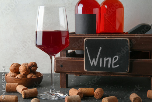 Glass of wine, walnuts and ...
