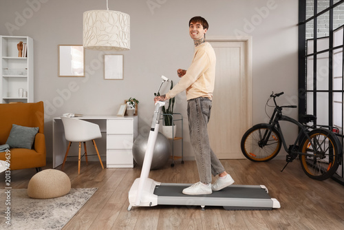 Young man training on tread...