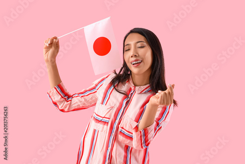 Young Asian woman with flag...
