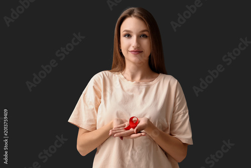 Pretty young woman with red...