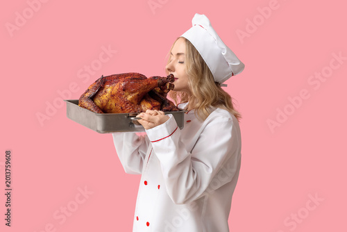Young female chef with tast...