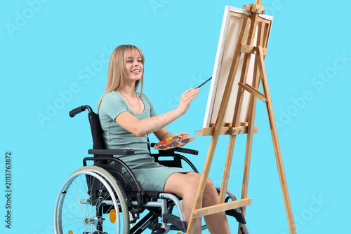 Young woman in wheelchair p...
