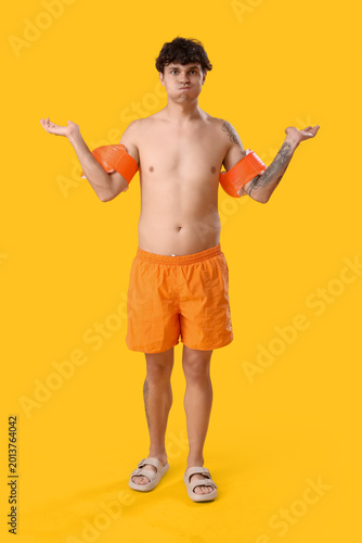 Young man with inflatable a...