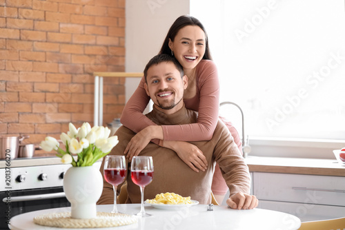 Happy young couple having d...