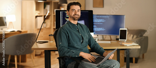 Male programmer with laptop...
