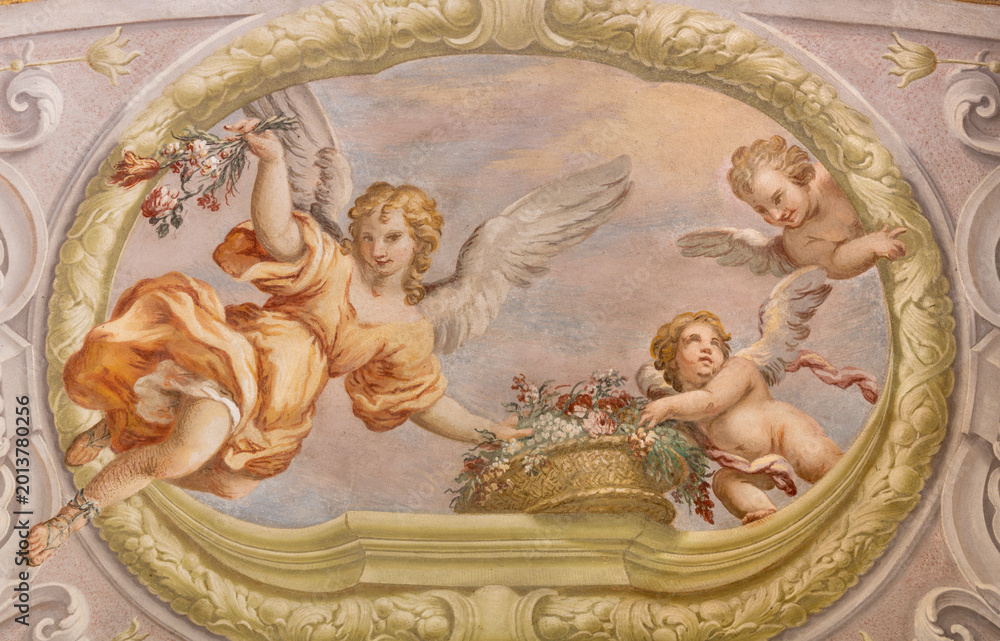 Fototapeta premium CREMA, ITALY - MARCH 20, 2026: The fresco of angels with the flowers the church Santuario di Santa Maria della Croce by Giacomo Parravicino - il Gianolo (1702).