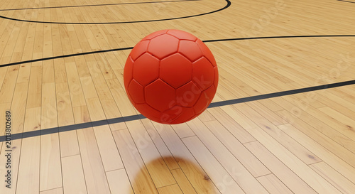 Red soccer ball on wooden basketball court