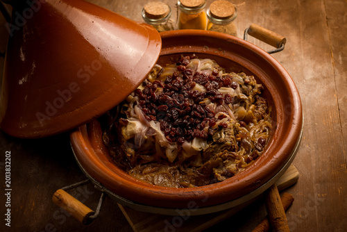 traditional moroccan lamb tajine with onions and dried grapes