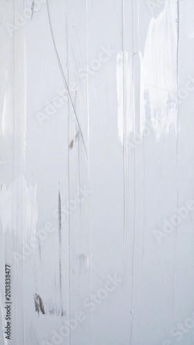 Close-up texture of white painted wall with visible strokes.