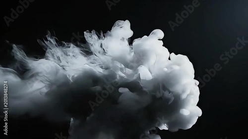 Smoke billows heavily across a dark background in a dramatic scene