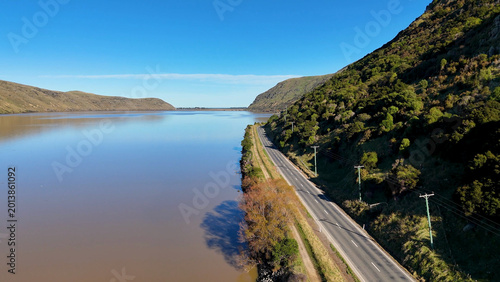 Photography Aerial View of a Coastal Road Beside Lake Forsyth in Akaroa