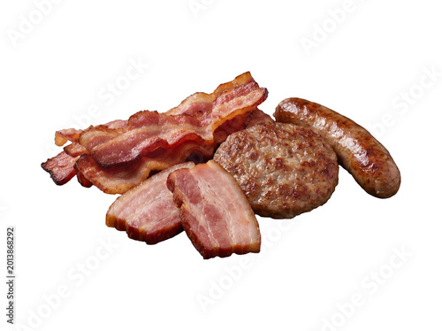 Cuadro en lienzo Cooked breakfast meats: crispy bacon, sausage patty, and a sausage link, isolated on a transparent background