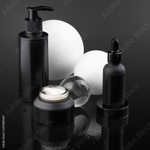 Luxury Black Cosmetic Product Mockups on Geometric Pedestals with Abstract Background