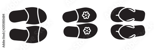 Cuadro en lienzo Black silhouette of different pairs of slippers and sandals top view