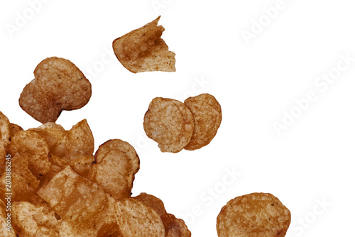 Obraz na plátně Crumbled cookies falling against white background in mid-air