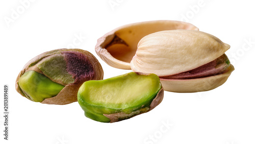 Fotografie Isolated close-up of fresh raw pistachios, shelled and in various open shells, h