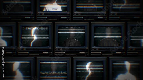 A looping background of stacked retro televisions with distorted glitch and interference noise featuring spinning faceless figures wearing shirts with the word OBEY..
