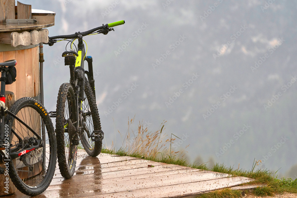 Naklejka premium Cycling in the Dolomite Alps on a rainy day