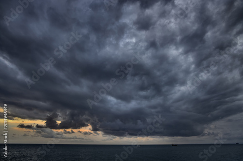 Fotografie Before the storm. The origin of a tornado over the sea.