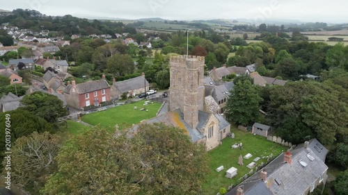 Aerial Drone View of St Mary's Church and Quaint Village of Burton Bradstock Dorset England UK