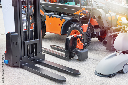 Electric pallet jack and warehouse lifting equipment outdoors
