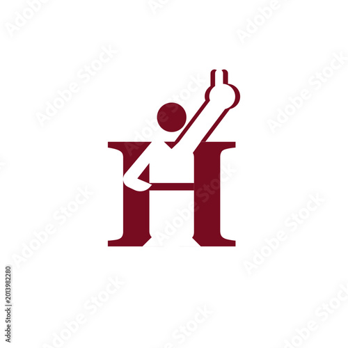 Person sitting on letter H.