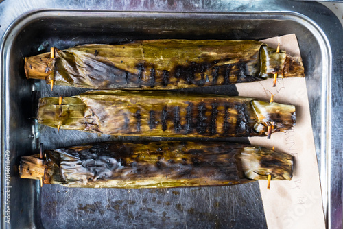 Foto Pepes Ikan, Indonesian dish with Steamed mackerel wrapped in banana leaves with aromatic Indonesian herbs and spices