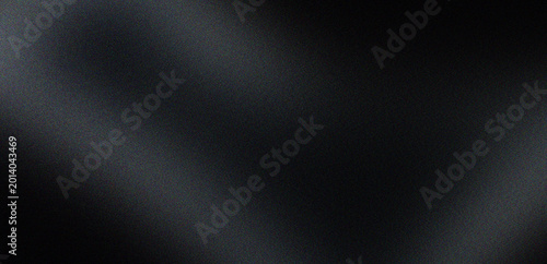 Fotografie Solid black abstract background with subtle diagonal light streaks and grainy texture