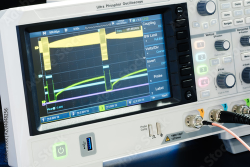 Foto Digital oscilloscope displays multiple colored waveforms