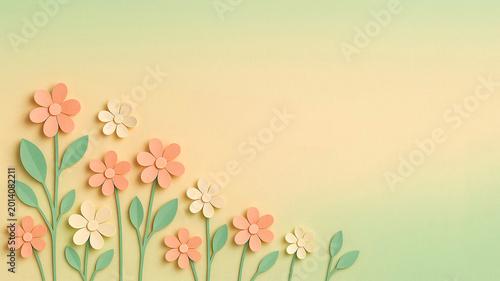 paper flowers with leaves on pastel background minimal composition
