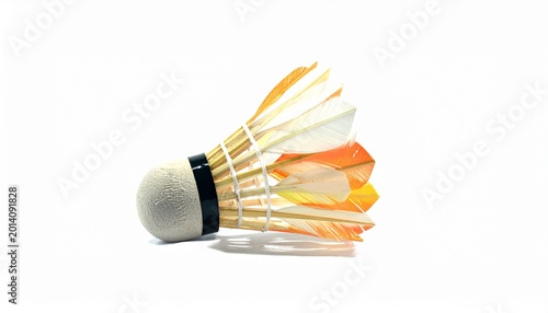 A badminton court with a racket lying on the green floor and shuttlecocks scattered around, under colorful indoor lighting, symbolizing sports practice, activity, and athletic training in progress.