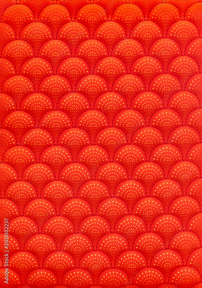 Obraz premium red leather background and texture as a pattern for the interior car or a sofa or wall covering