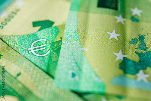 Bilde på lerret Detailed close-up of euro banknotes with green shades, security strips and denomination markings
