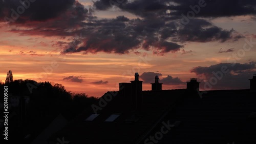Dramatic Red Sunset Over German Town Skyline