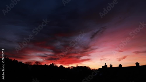 Dramatic Red Sunset Over German Town Skyline