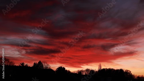 Dramatic Red Sunset Over German Town Skyline
