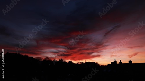 Dramatic Red Sunset Over German Town Skyline