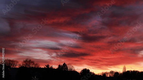 Dramatic Red Sunset Over German Town Skyline