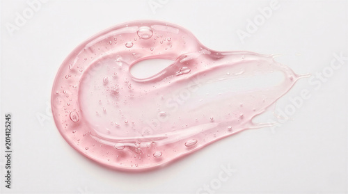 Smear of pink transparent cosmetic gel with micro bubbles on a white background.