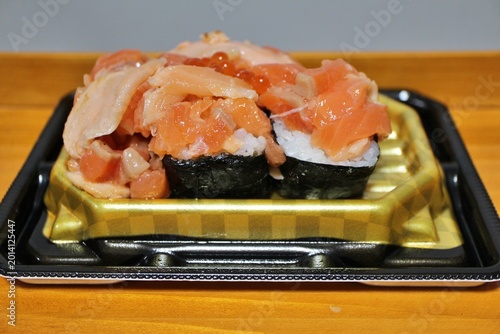 Salmon and ikura (salmon roe) sushi purchased at a supermarket in Tokyo, Japan