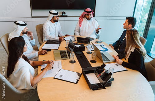 Photography Diverse business professionals having strategic meeting in modern boardroom