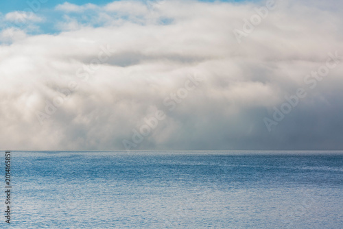 Fog and clouds clearing on East Sound, Orcas Island.