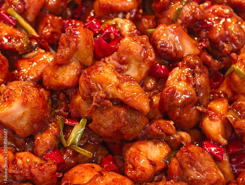 Quadro su tela Close-up Kung Pao Chicken with glossy sauce, with red chilies and scallions