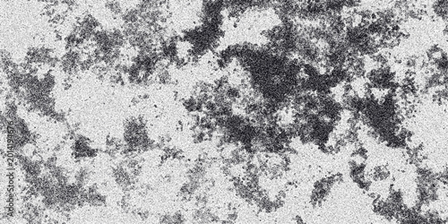 Cuadro en lienzo Abstract grayscale textured background with dark speckled clusters against a lig