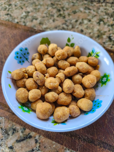 Close view of a small bowl with cracker nuts