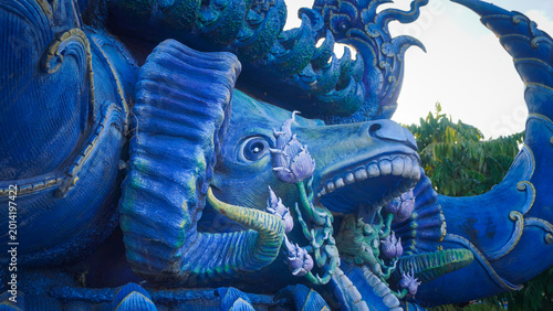 Fényképezés Intricate Mythical Blue Creature Sculpture at Wat Rong Suea Ten, Chiang Rai