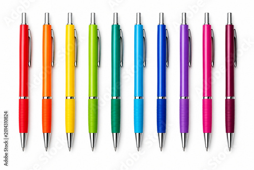 Large set of colorful ballpoint pens with silver accents in rainbow spectrum isolated on white