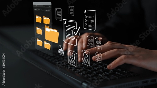 Foto Person Typing on Laptop with Digital File Management Graphics and Modern Technol