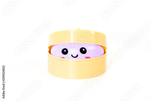Tableau sur toile Squishy dumpling toy on white background in steamer basket