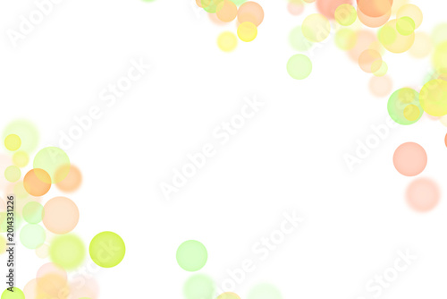 Soft pastel green and yellow bokeh circles on white background 